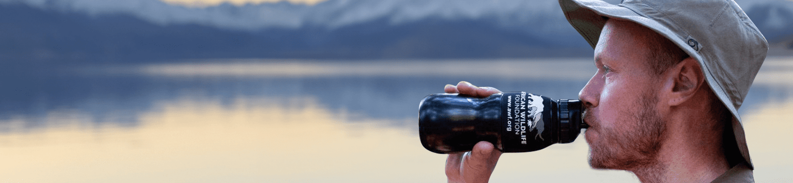 Man drinking from custom branded Water to Go water filter bottle