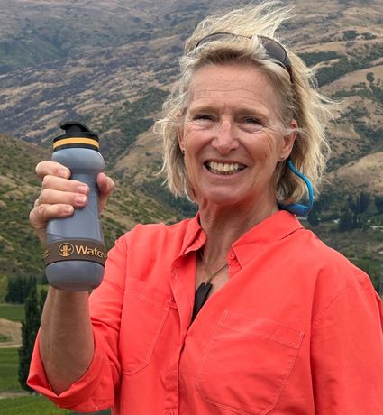 Woman smiling holding Water_to_Go Bioplastic water filter bottle