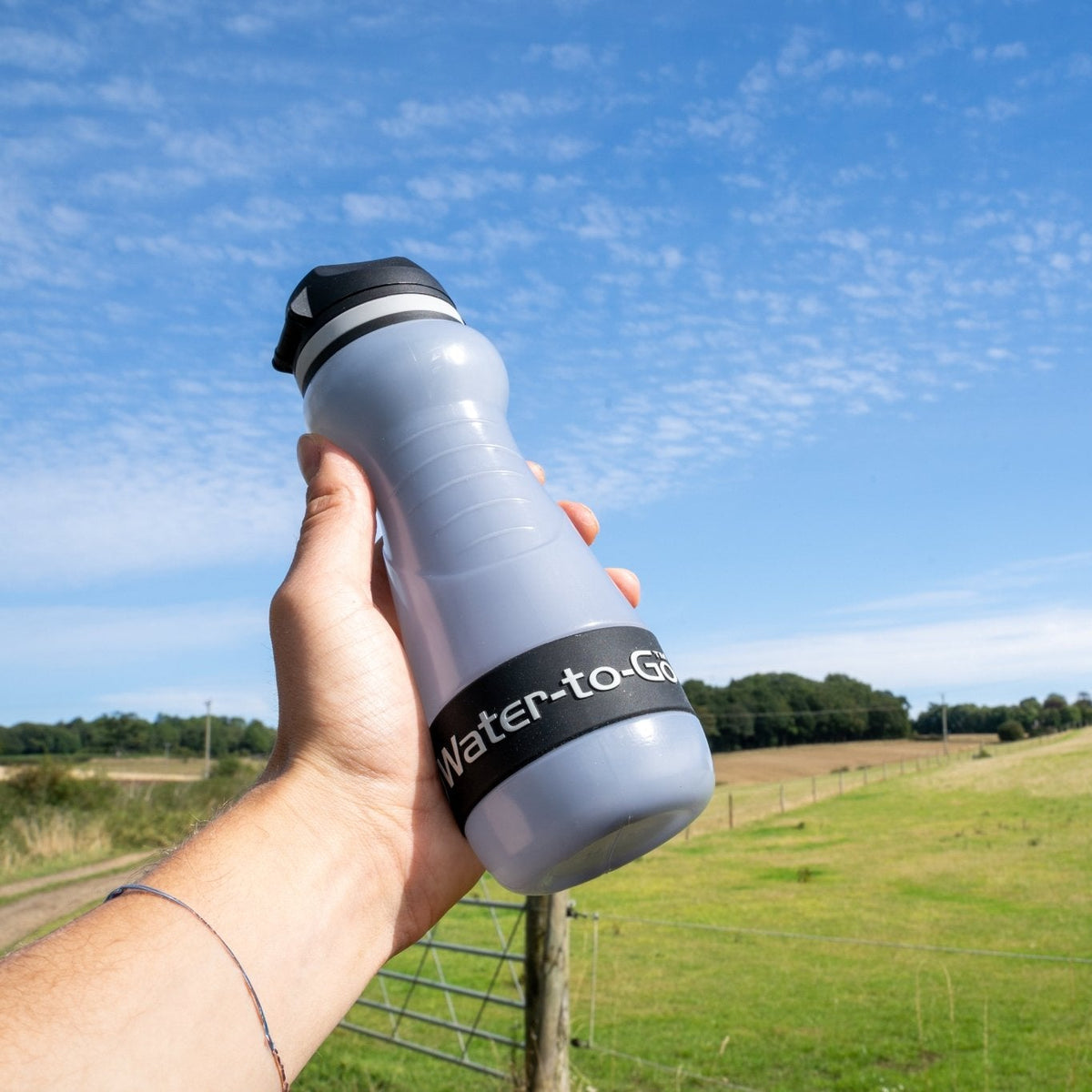 hand holding small water filtration bottle