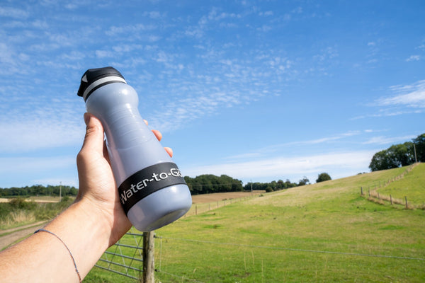 hand holding small water filtration bottle